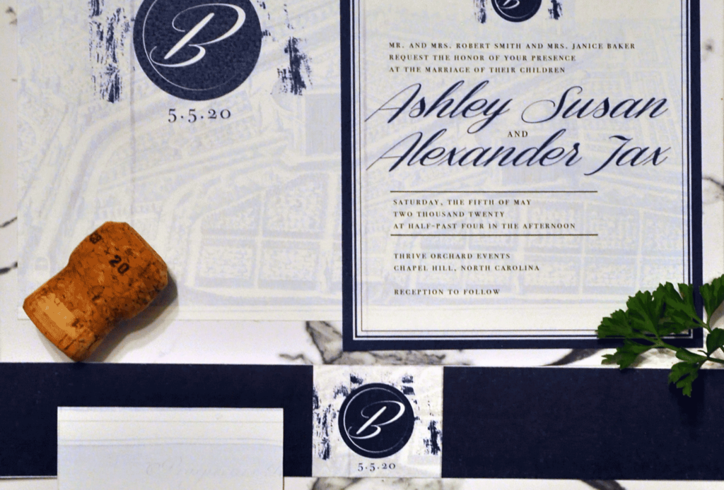 map print vintage style wedding invitation with belly band and bordered insert cards