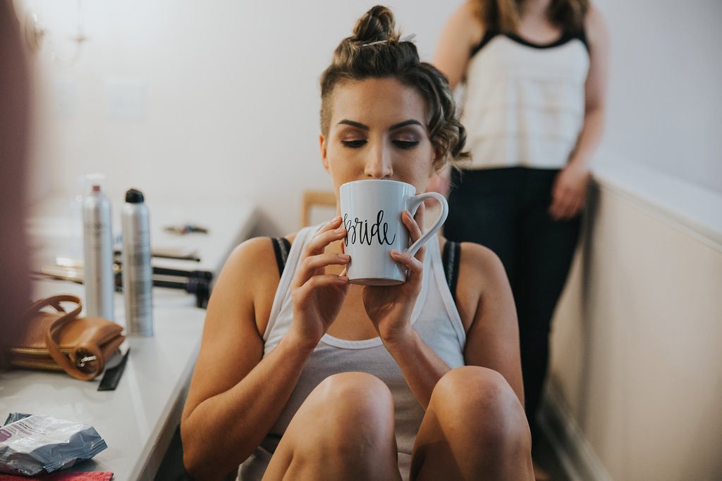 Bride drinks coffee | revelry + heart | wedding regrets