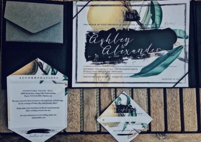 Black, yellow and green botanical wedding invitation suite with diamond shaped cuts