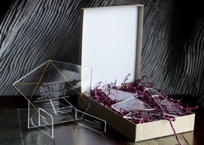 Clear acrylic wedding invitations that interlock to form a 3d sculpture