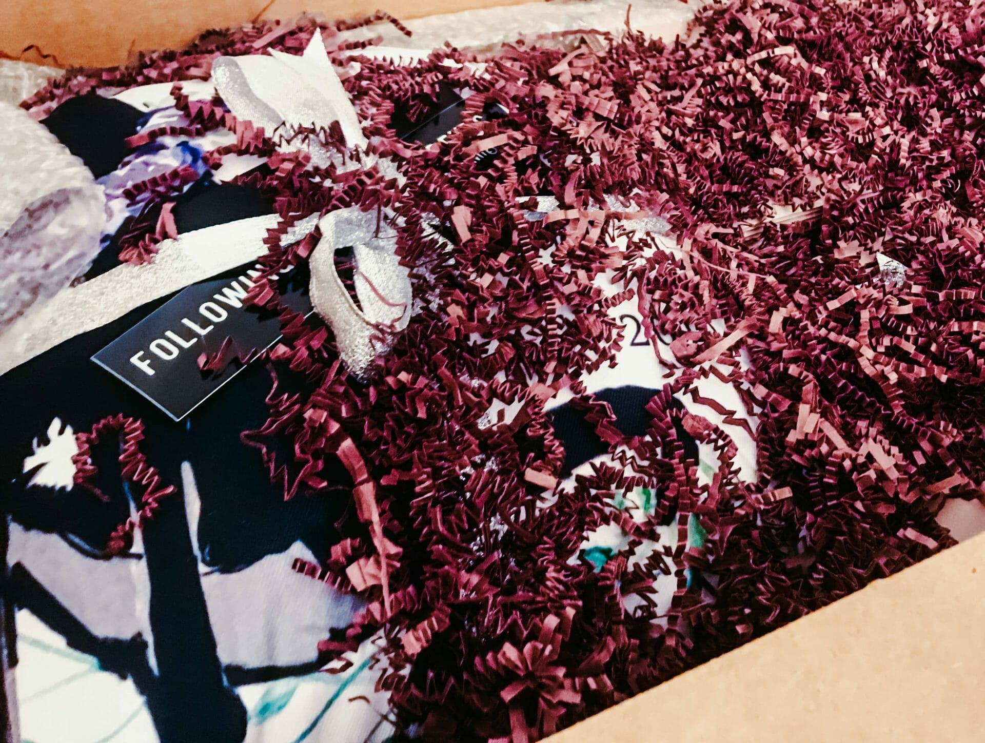 Box filled with custom gifts and gift wrapping